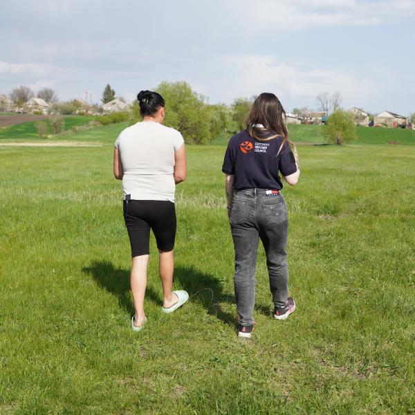 Alina, participant of the programme, shows ERC team a pasture
