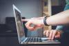 lap top finger pointing to screen
